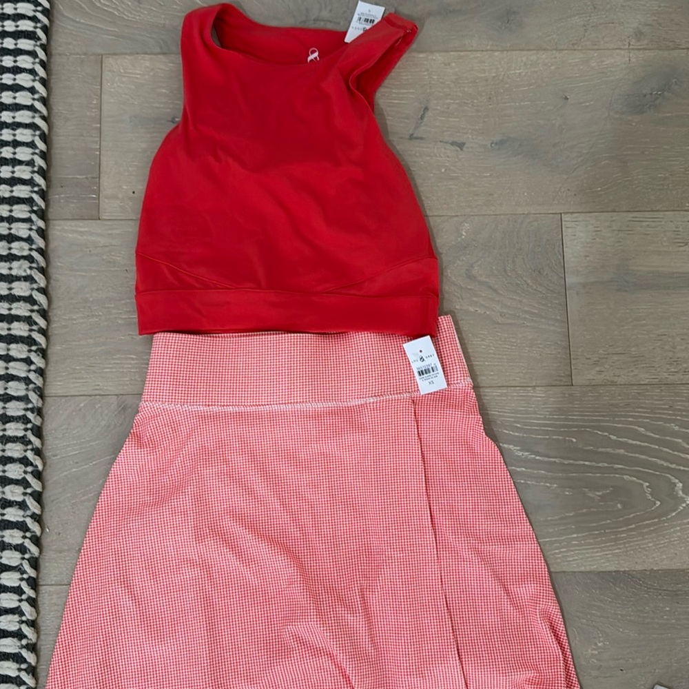 Loft tennis skirt and top with tags in a dark orange color